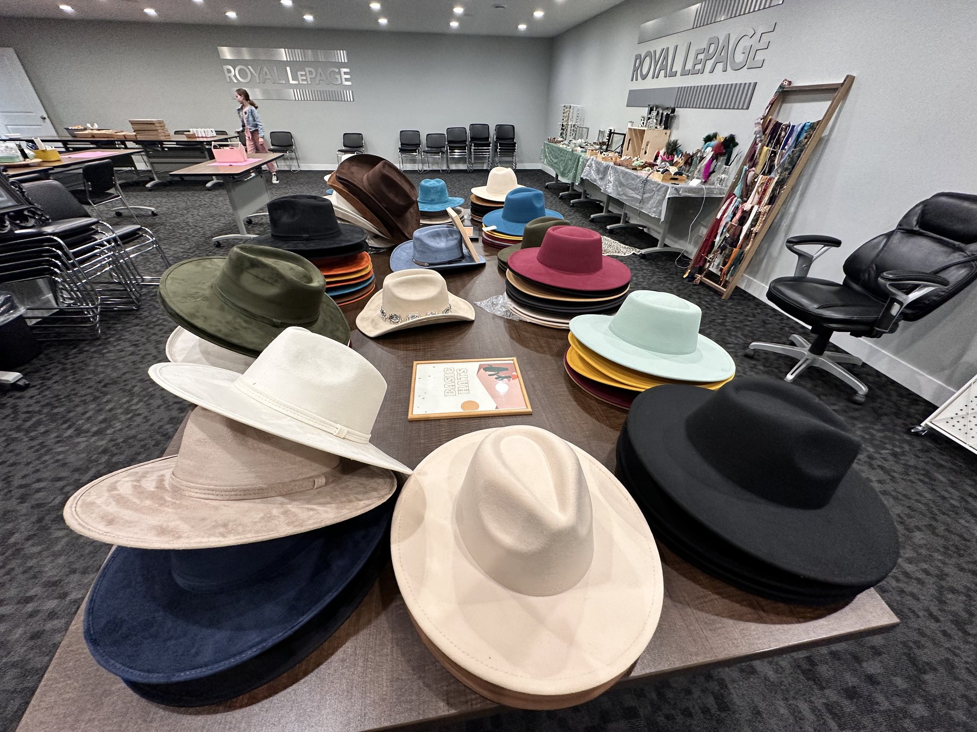 Table of premium hat colours styled for a Royal LePage Kamloops corporate hat bar event
