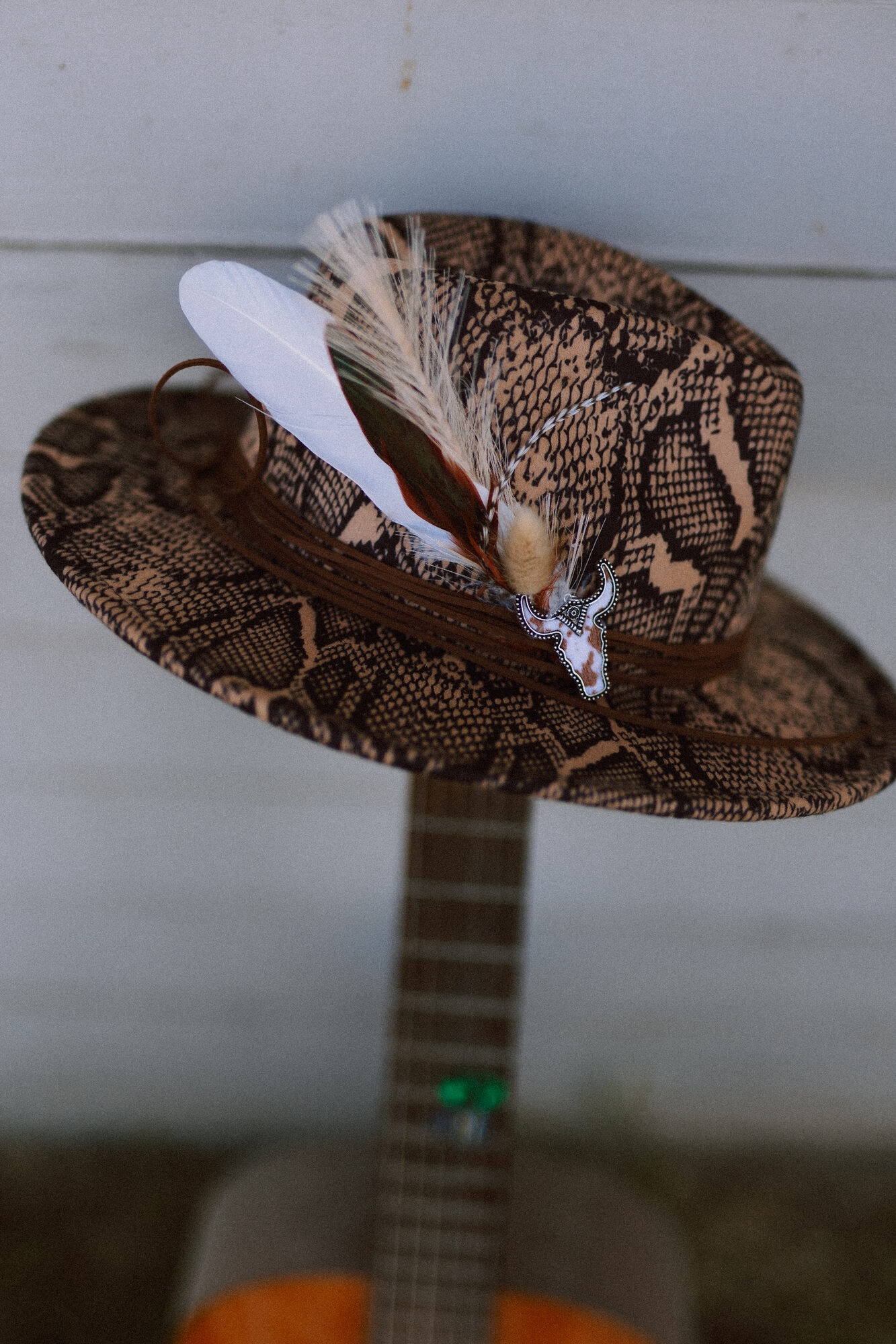 Finished custom hat styled with dried florals and feathers