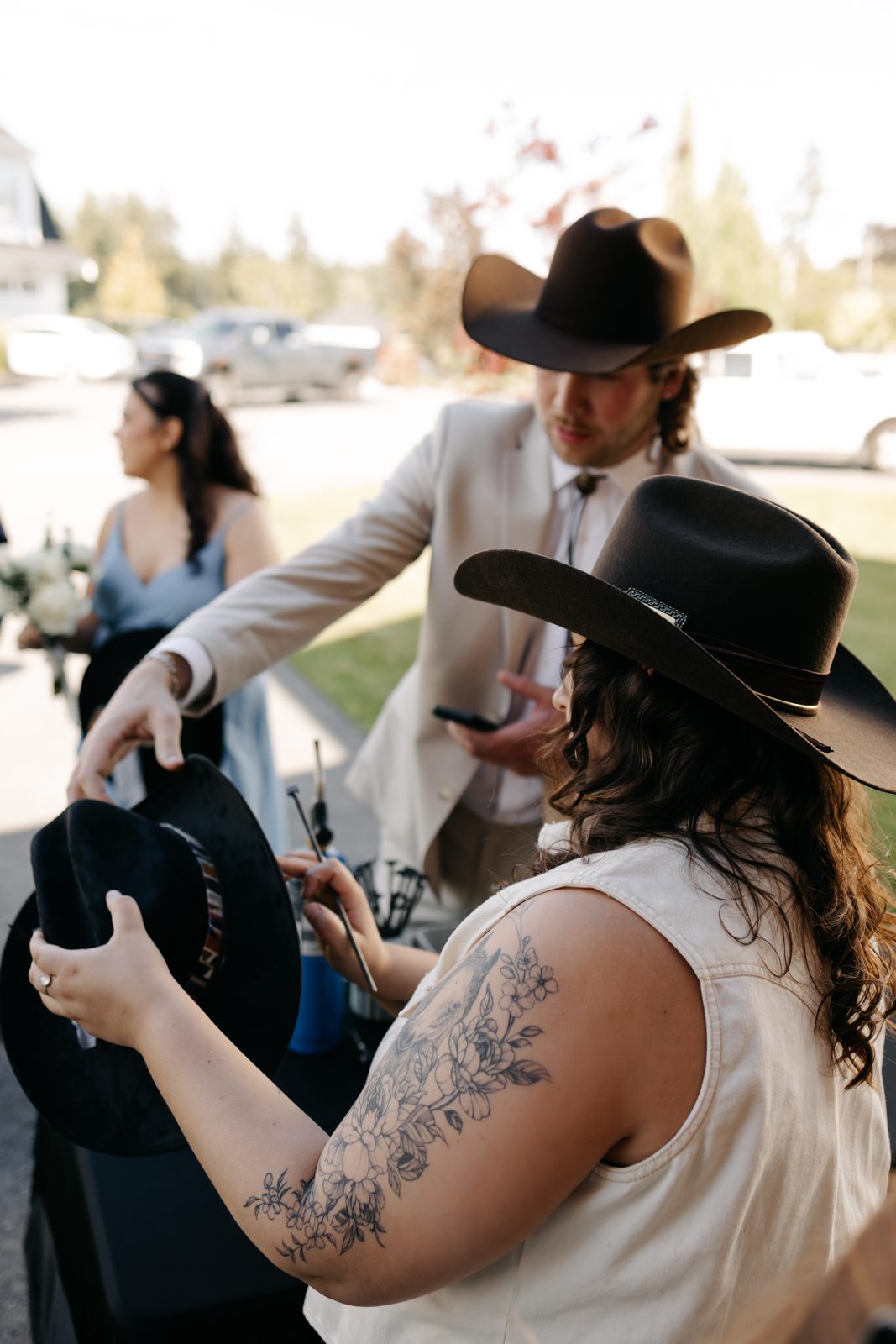 Guest getting her hat live-branded at the bar