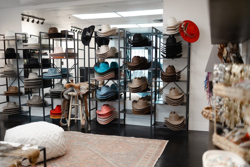 Wall of cowboy hats in every color at Saddle N Spurs Kelowna