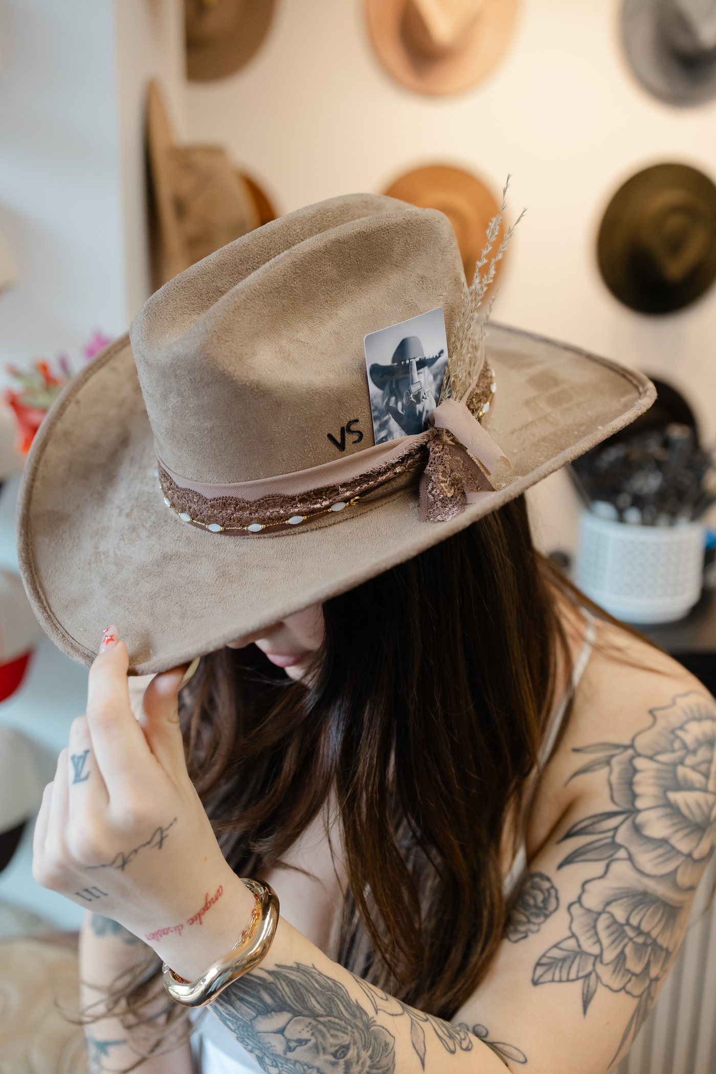 Custom hat with a monogram and polaroid photo tucked into the band at Saddle N Spurs Kelowna