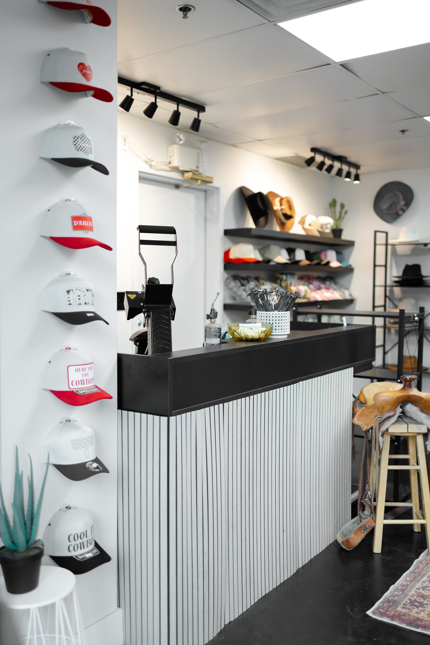Saddle N Spurs Kelowna storefront counter and hat wall, downtown Water St