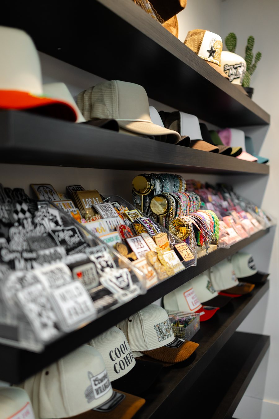 Wall of trucker hats, patches, and accessories at Saddle N Spurs Kelowna