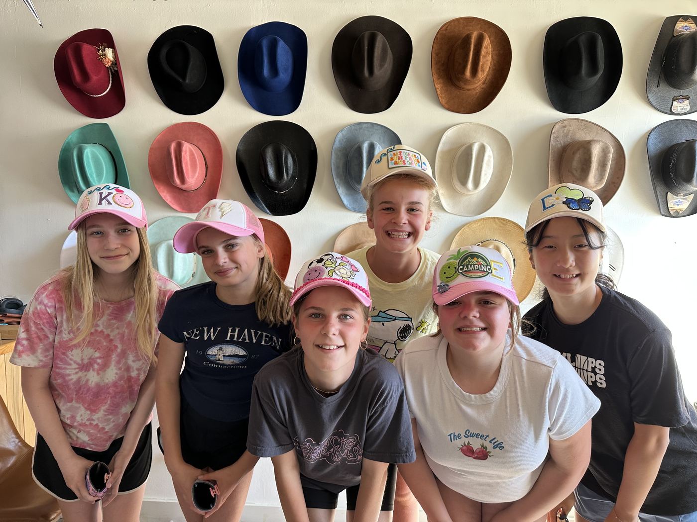 Kids wearing custom patched trucker hats at a Saddle N Spurs birthday party