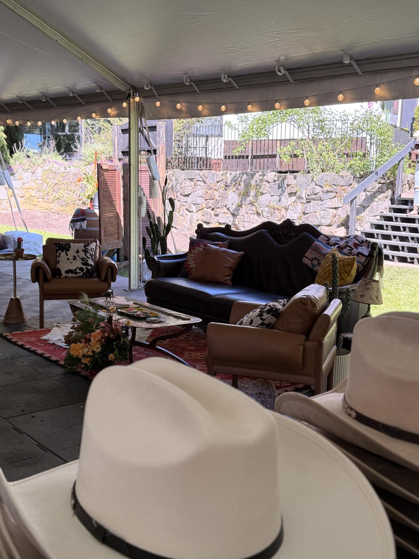Mechanical bull activation at dusk with mountain views at the Brock House private wedding