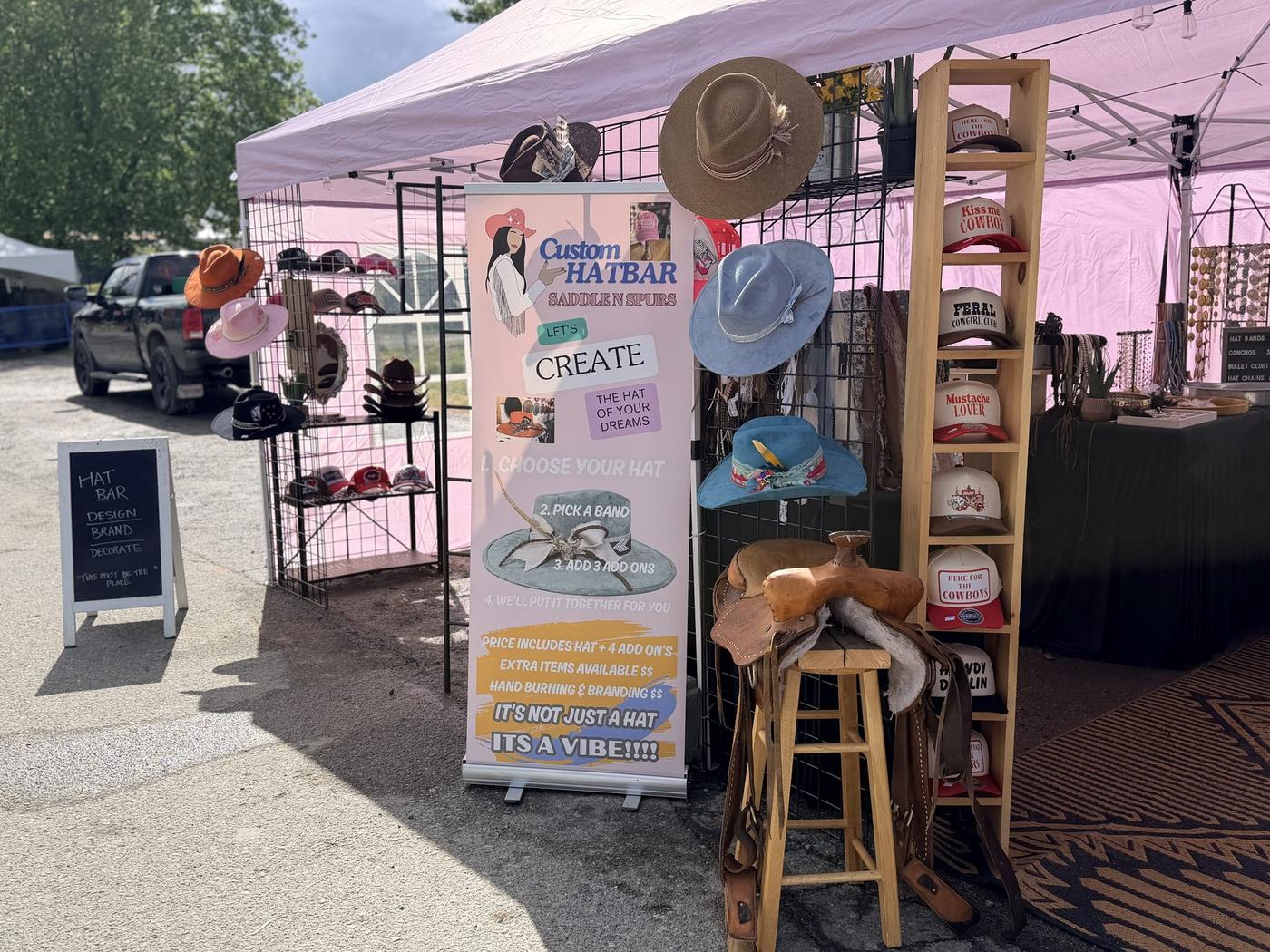 Saddle N Spurs hat bar booth and hat wall display at the Cloverdale Rodeo and Country Fair