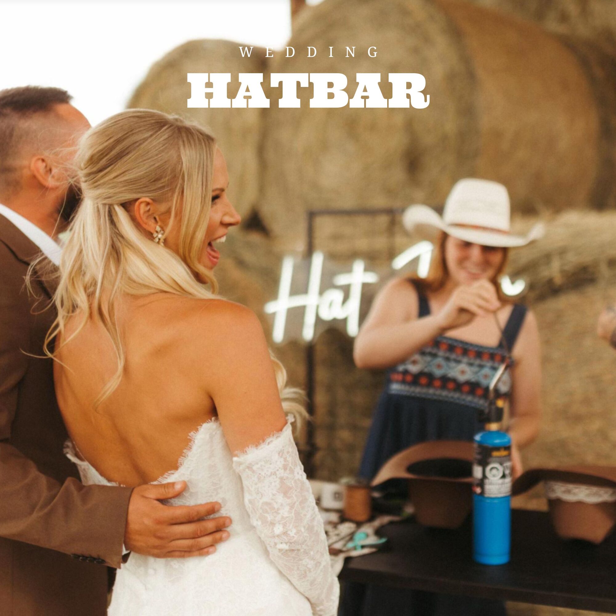 Bride and groom at their hatbar in front of hay bales